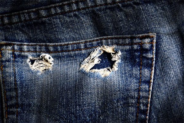 Why Heavy Ripped Denim Pants Are a Street Style Favorite