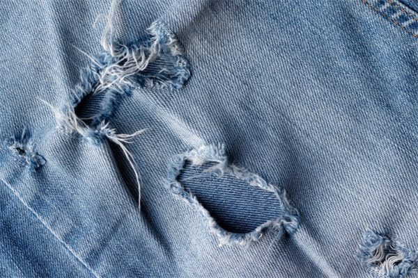 How to Achieve a Grunge Look with Patched and Ripped Denim