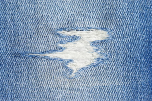 Custom Denim Tearing And Sanding Processes For Modern Trends