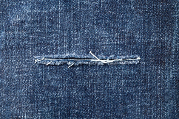 The Perfect Balance of Ripped and Repaired Denim for a Cool Vibe