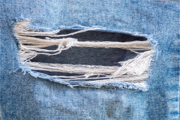 Custom Denim Fraying And Ripping Processes For Modern Collections