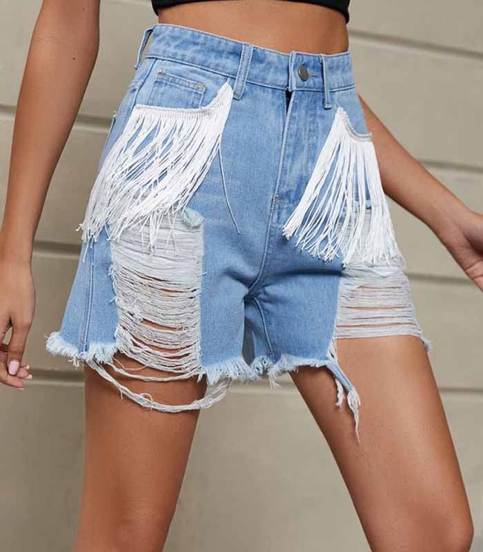 New personality tassel washed denim shorts
