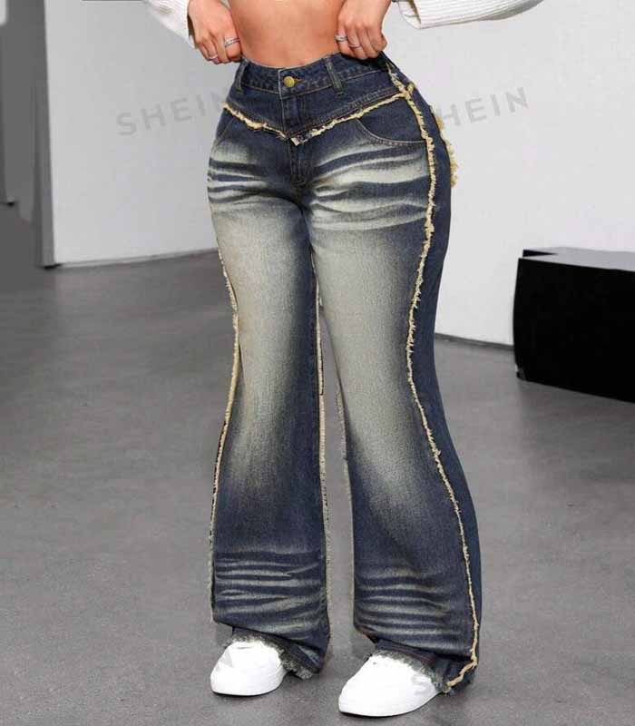 Women's black vintage-style flare jeans with whisker distressing