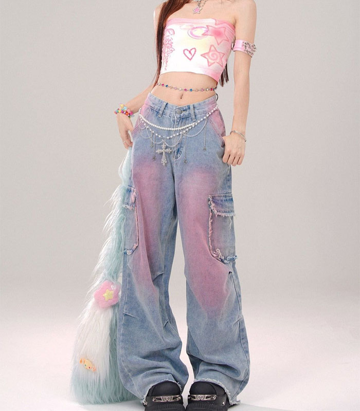 Pink spray-dyed wide-leg jeans with oversized pockets, raw-hem detailing, and a stone-washed finish
