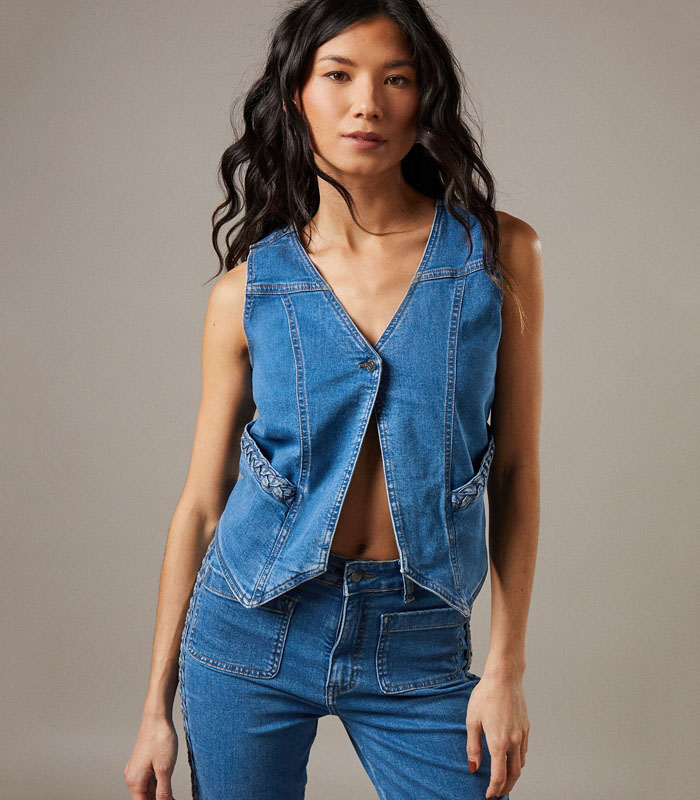 Boxy fit denim waistcoat with distinctive button front closure Sleeveless design with V-neckline